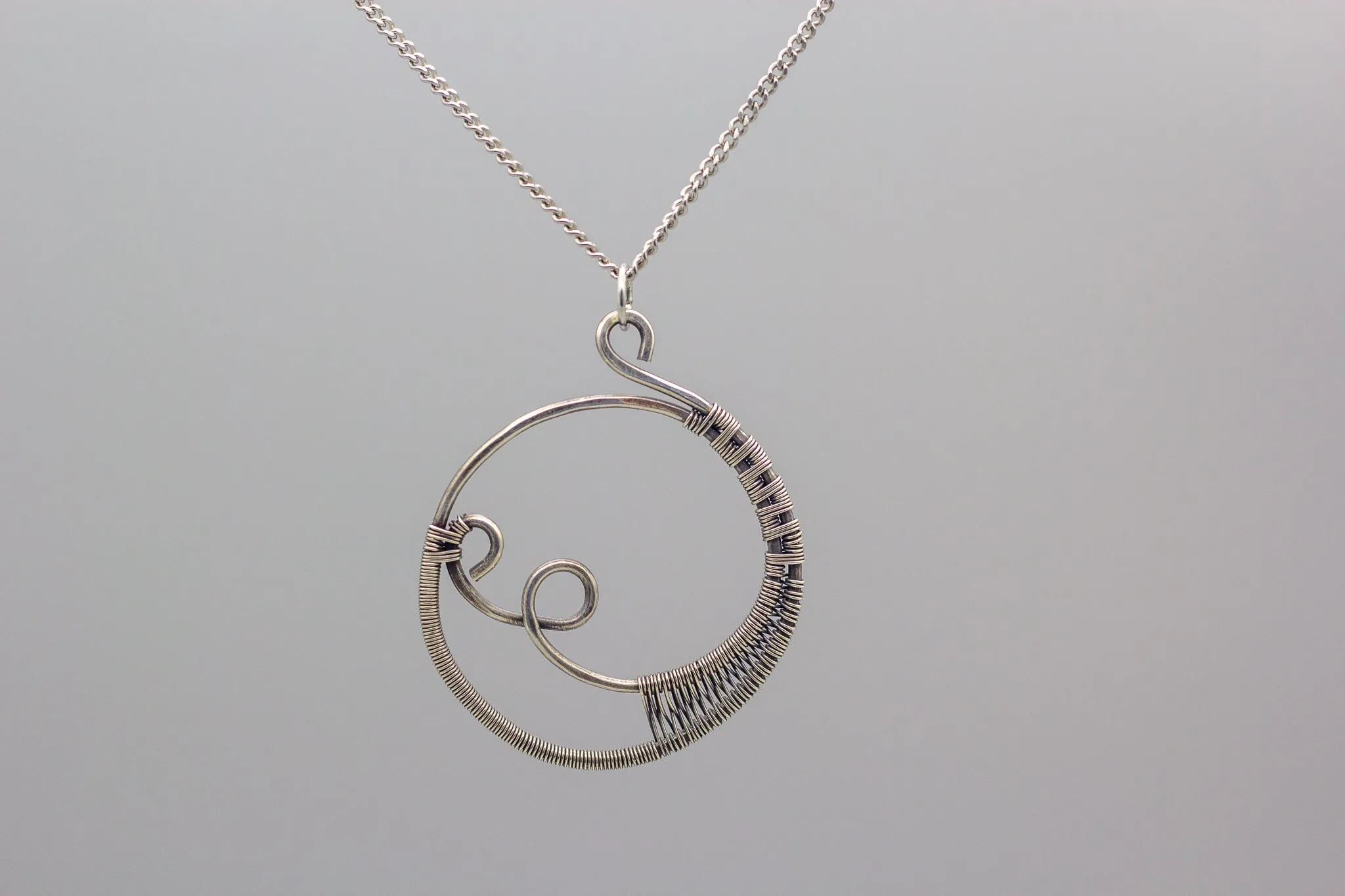 Circular Sterling Silver Wire Wrapped Pendant