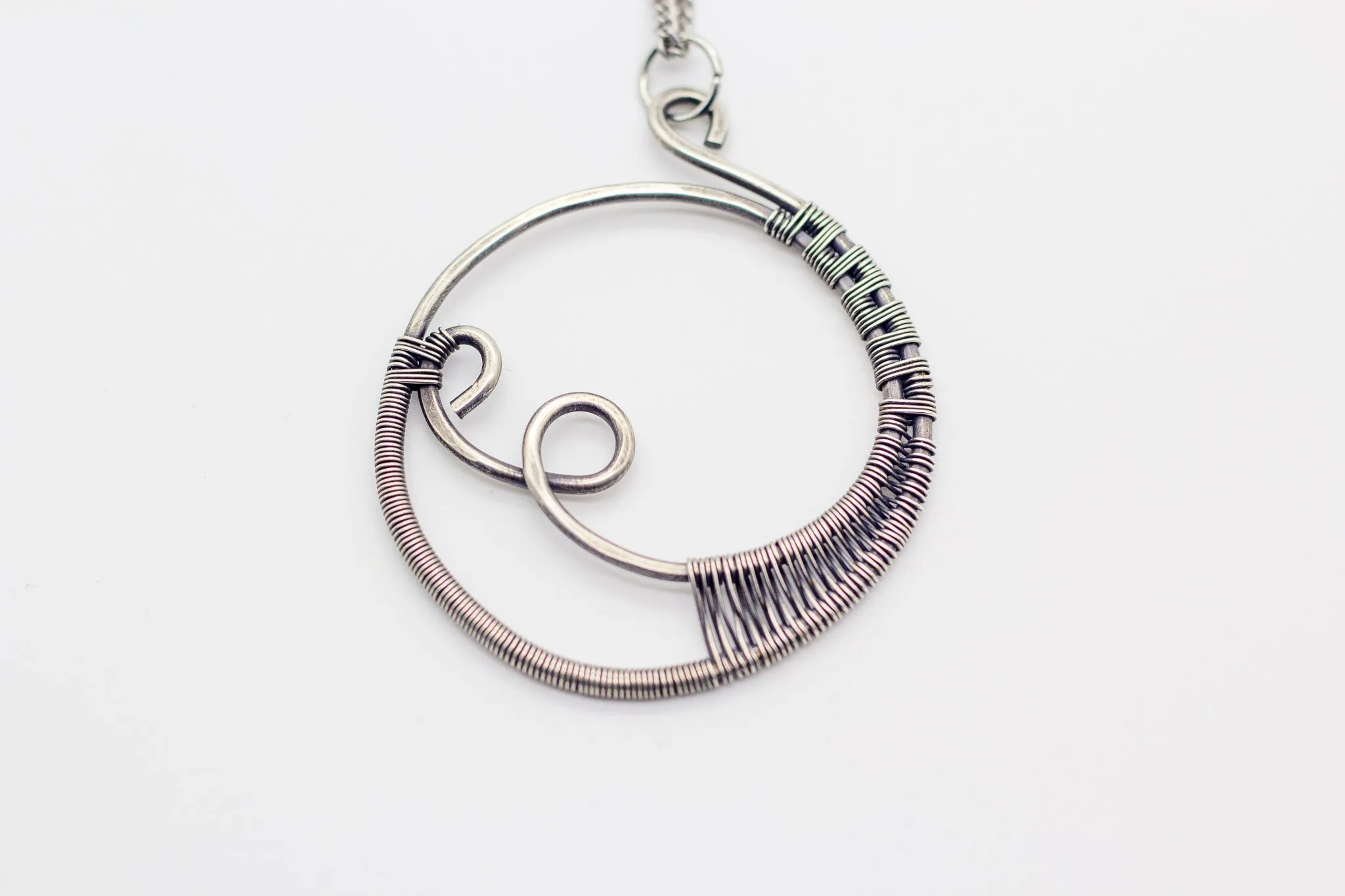 Circular Sterling Silver Wire Wrapped Pendant