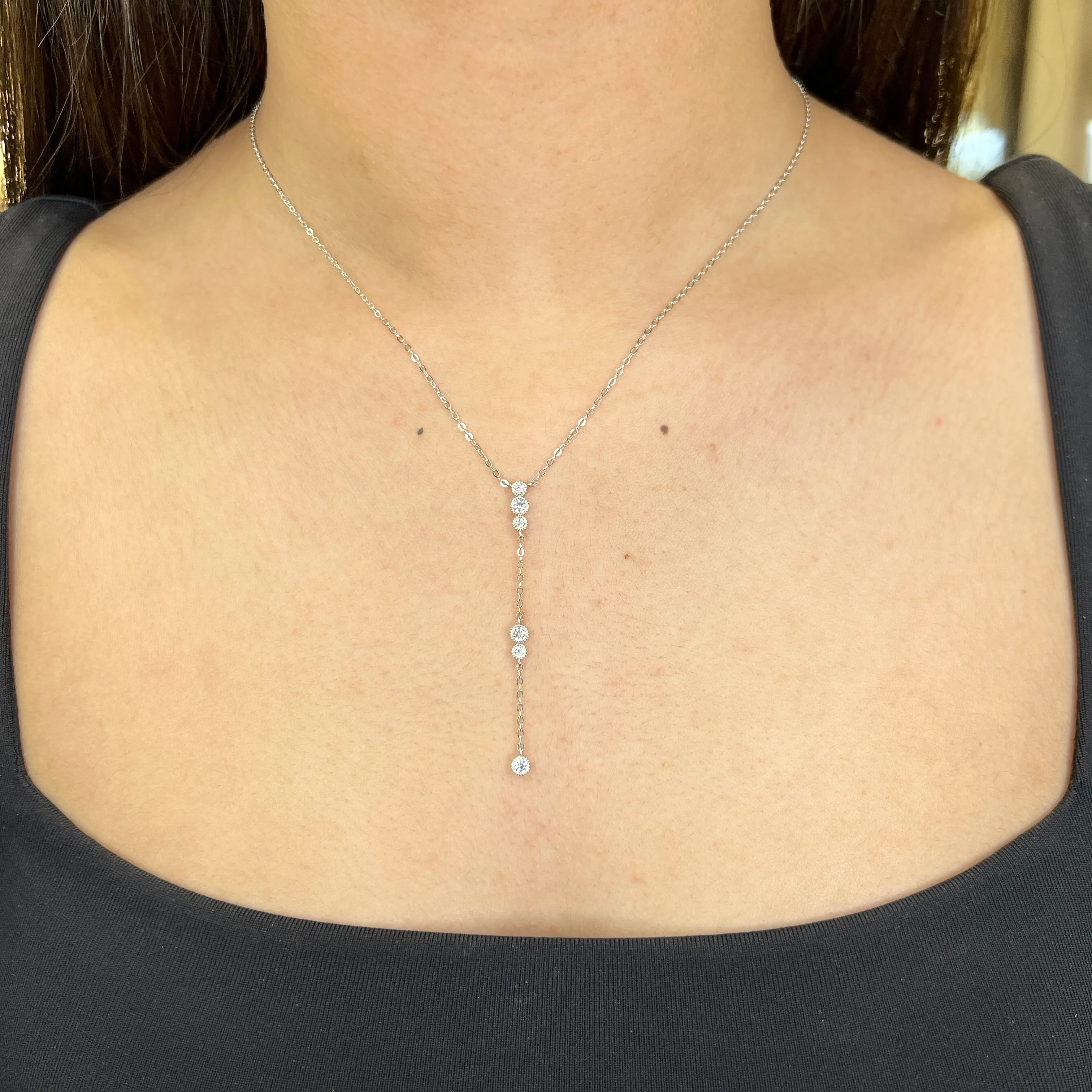Reign Sterling Silver Rhodium Plated Milgrain Accents CZ Lariat Necklace