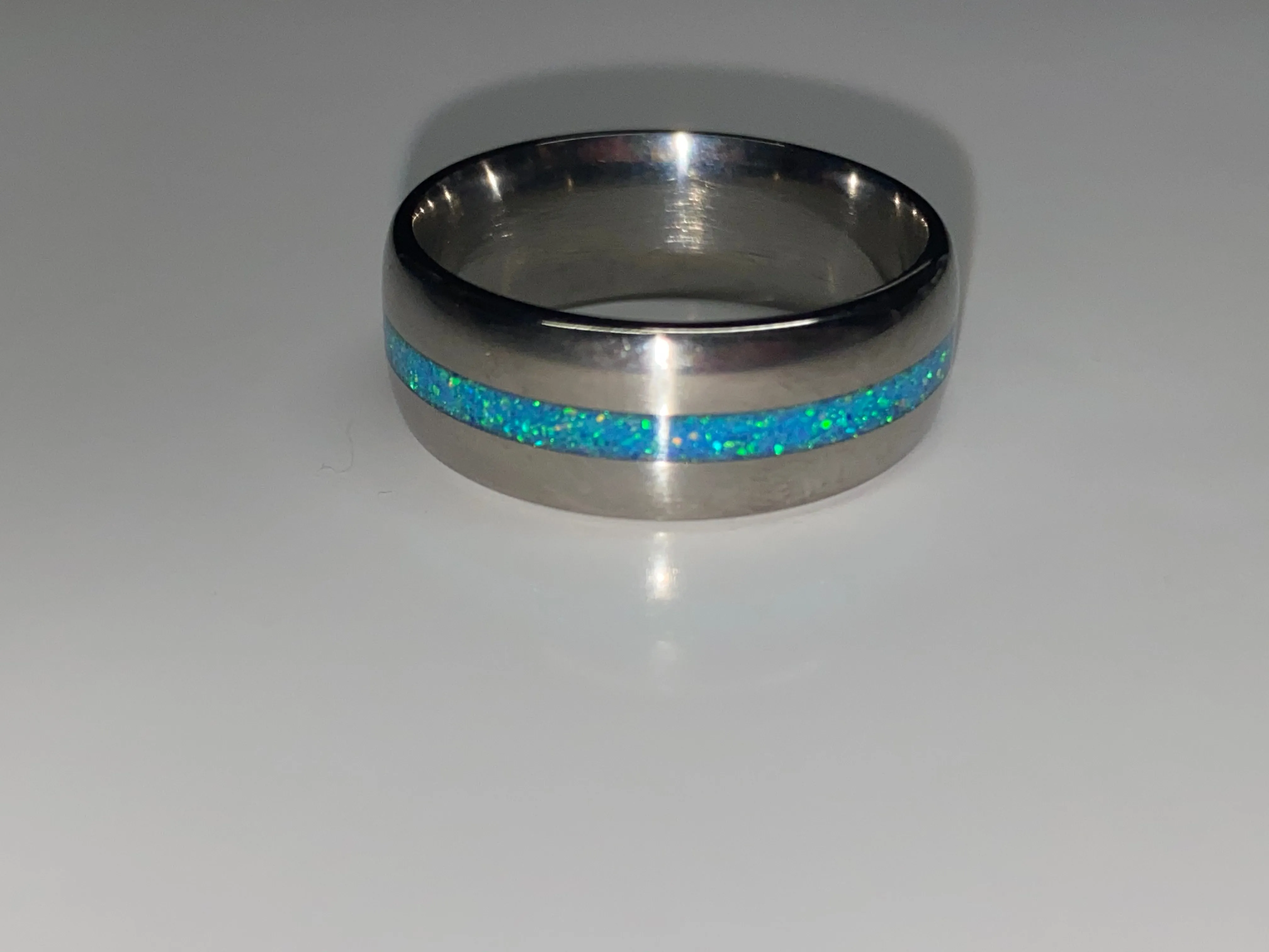 Titanium with blue opal inlay